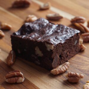 Indulge in this rich, homemade chocolate brownie topped with crunchy pecans.
